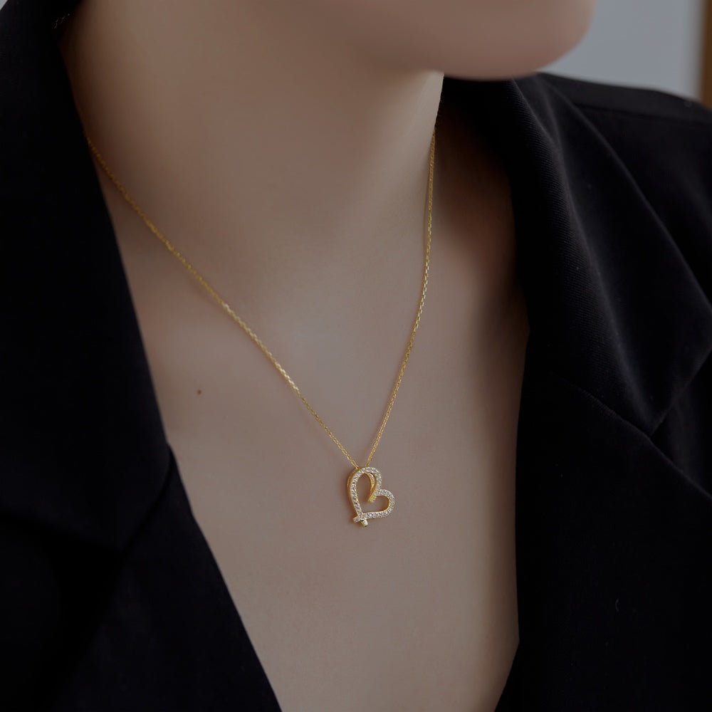 Image of showing someone wearing a heart shaped necklace