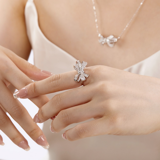 An image of one showing off a ring on display